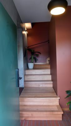 Cut-down bricks are used as floor tiles in the entry. The stairs were made from Southland maple...