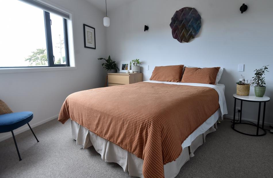 The two bedrooms and bathroom are at the back of the apartment, a few steps above the living area...