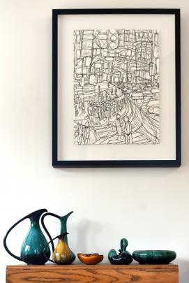 Blue Mountain pottery sits beneath a print by Simone Scrivener.