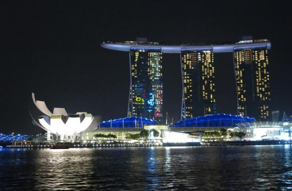 The distinctive and  bizarre Marina Bay Sands makes its presence felt at night.