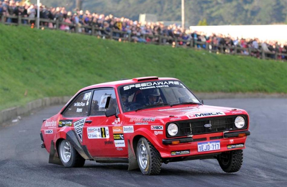 Alistair McRae entertains the crowd  in his Ford Escort at the tarmac super stage on Saturday....