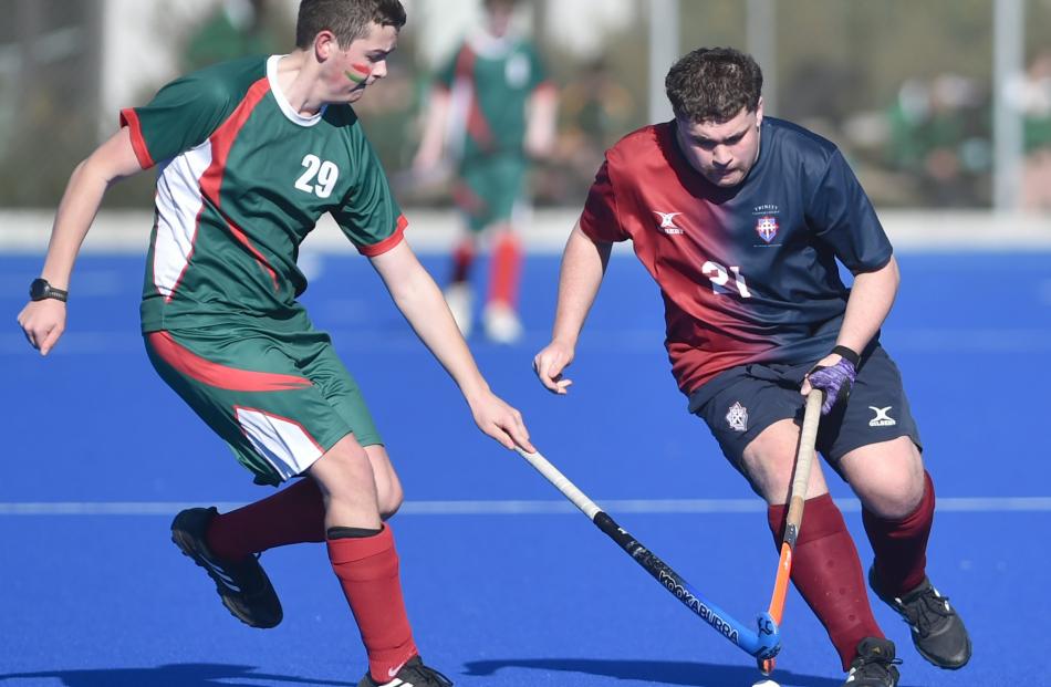 Lucas Jago (right, Trinity College), 16, is challenged by Tom Blackmore (Menzies College), 16....