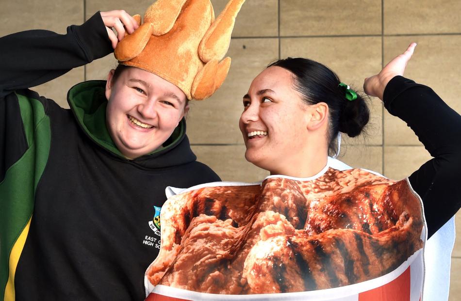 Addisyn Lawrence, 16, (left) and Lakaia Harris, 16, of East Otago High School, have buckets of...