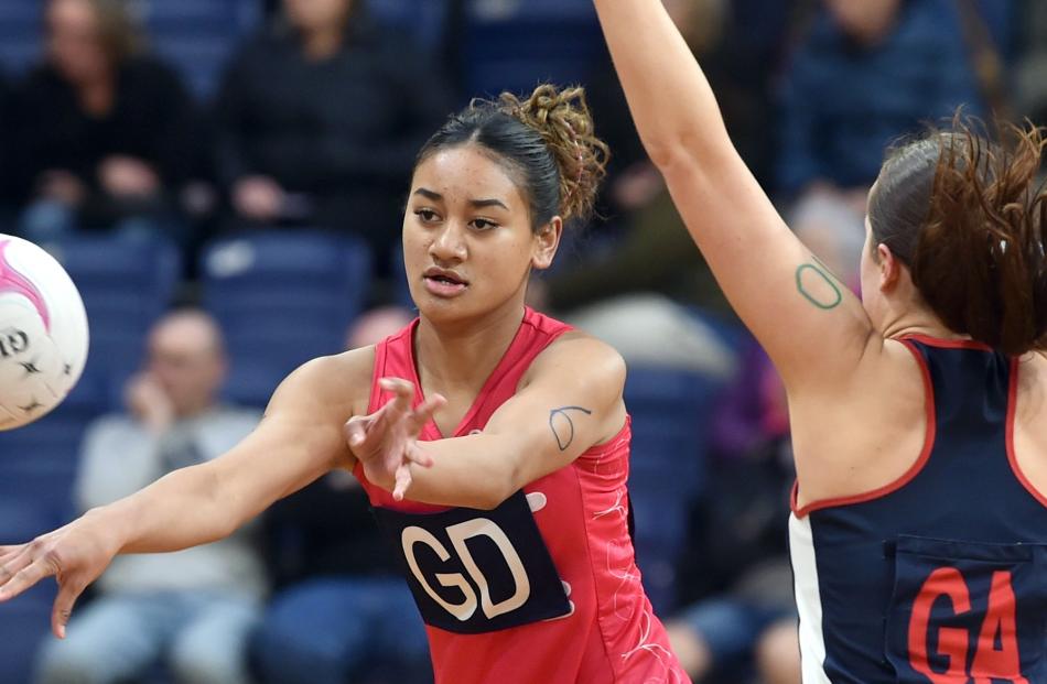 Kymorah-Lee Taiala (Otago Girls’), 16, fires off a pass under pressure from Amelie Martin ...