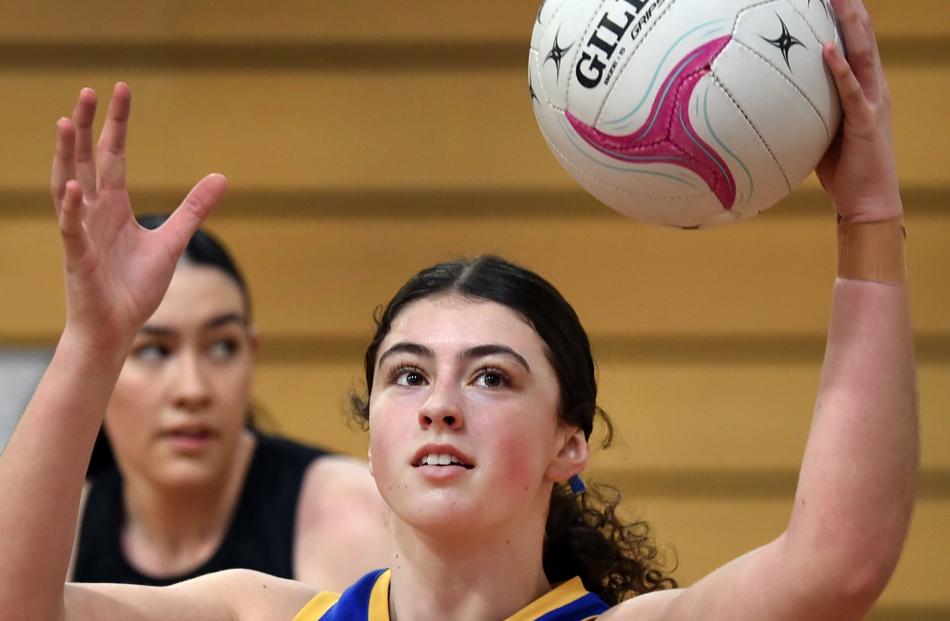 Bella Hughes (Taieri College), 17, hauls in a pass at the Edgar Centre. PHOTO: PETER MCINTOSH