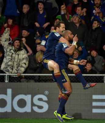 Patrick Osborne is congratulated by Smith after scoring a try against the Crusaders at Forsyth...