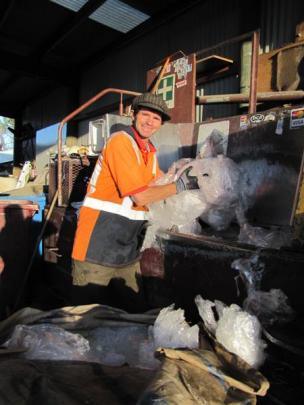 Wanaka Wastebusters employee Bruce Shanks bales plastic ready to be shipped to China.