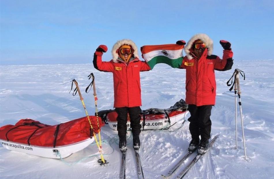 The Malik twins at the North Pole  with the Indian flag.