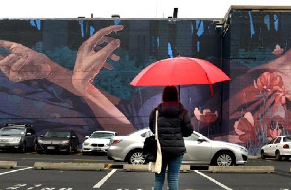 Shelley Mackay admires a Dunedin mural by Polish artist Bezt in the Scenic Circle Southern Cross...