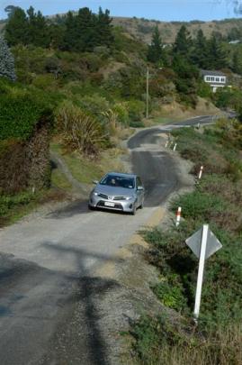 A car negotiates Haven St after it was reduced to a single lane in May 2013. Photo by Gerard O...