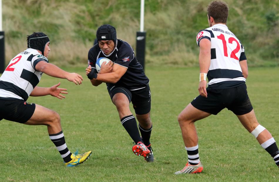 Pirates lock Motu Huch prepares to collide with the Southern defenders Joe Weatherall (No 2) and...