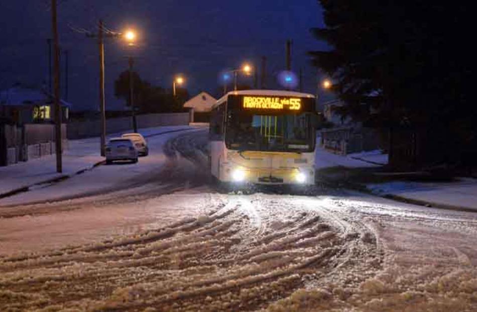 An early morning bus in Ashmore St, Halfway Bush, yesterday morning. PHOTO: GERARD O'BRIEN.