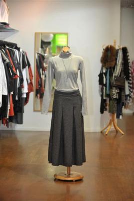 Nyne wool box-pleated midi skirt teamed with Kowtow turtle-neck top at Hype.
