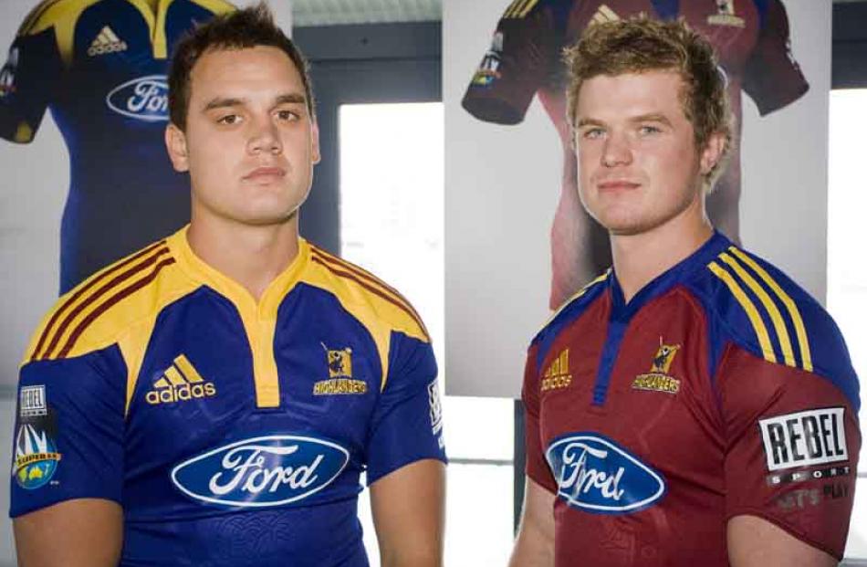 Israel Dagg and Kendrick Lynn wear the new Super 14 Highlanders home and away jerseys from sports...