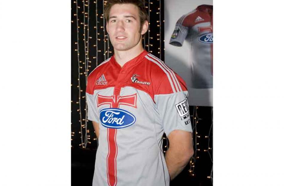 Michael Paterson wears the new Super 14 Crusaders jersey from sports clothing company Adidas,...