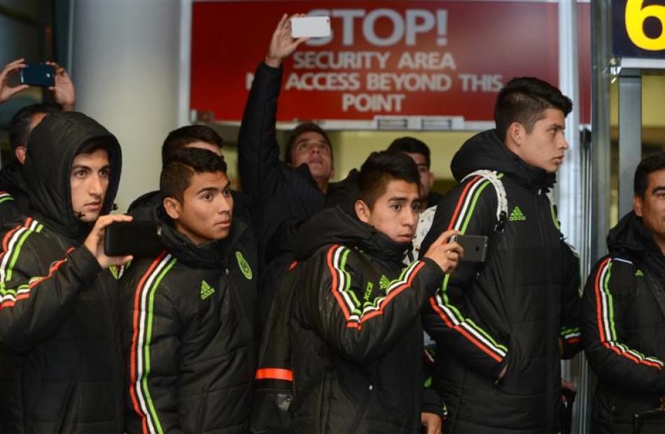 The Mexico Fifa U-20 World Cup team members take photos of the King's and Queen's High Schools...