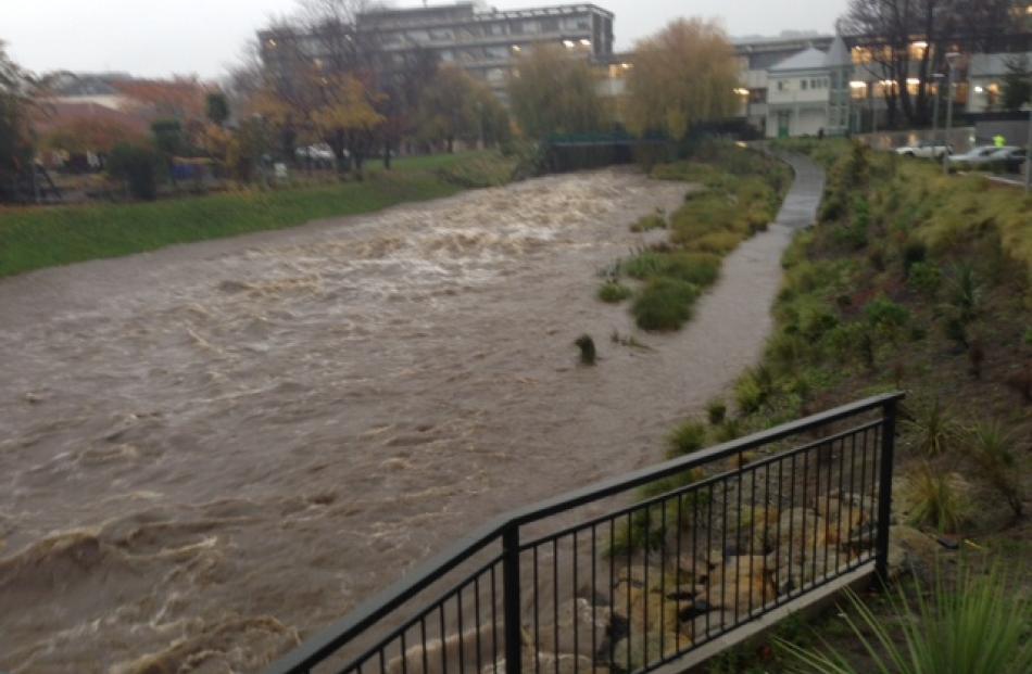The swollen Leith near the University of Otago's Commerce Building.