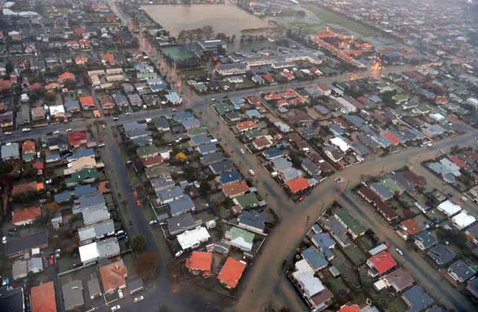 Hargest Cres (foreground), Queen's High School (rear left) with a flooded Tonga Park behind and...