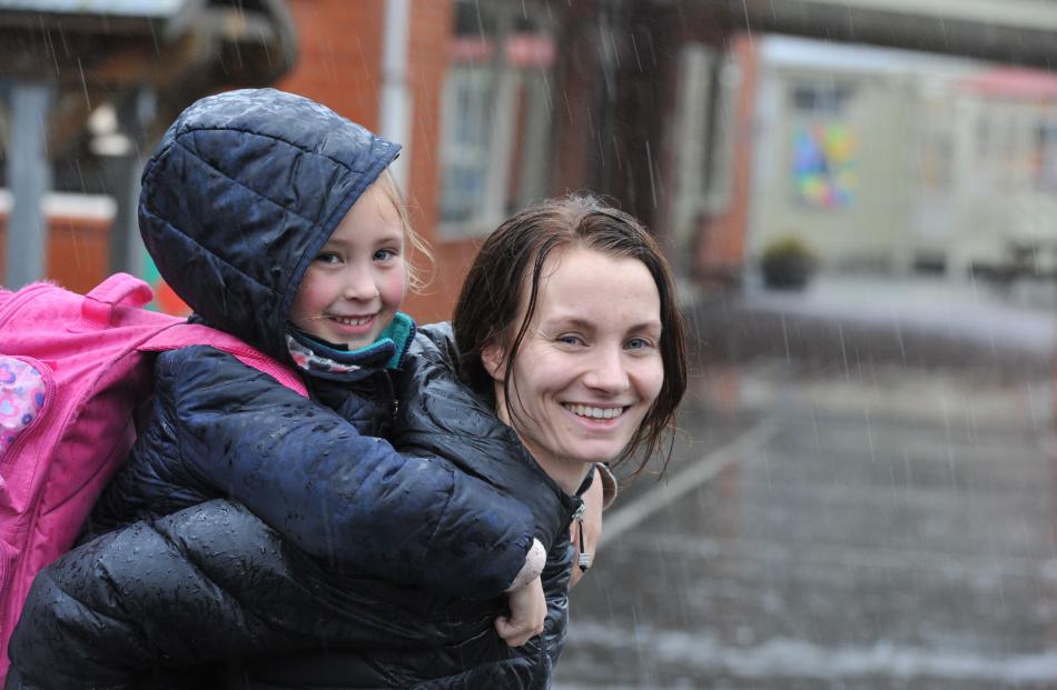 alia Morrison (5) and Annalies Scott were happy enough evacuating from East Taieri School. PHOTO:...