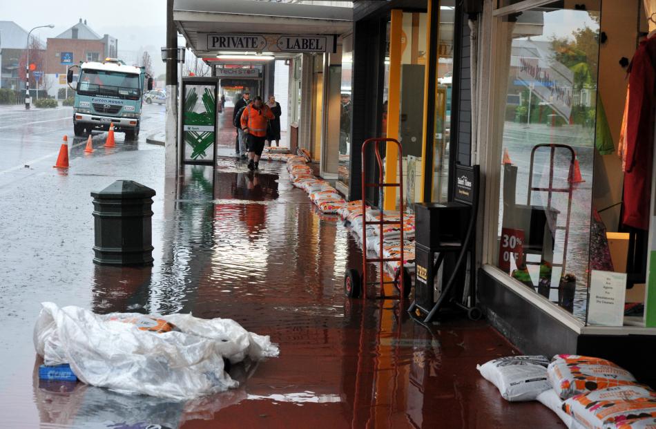 Flooding and sandbags in  Gordon Rd, Mosgiel,  yesterday.  PHOTO: GREGOR RICHARDSON