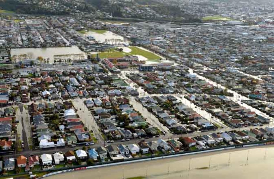 Floodwater lingers at St Kilda, Forbury Park raceway is in the foreground.