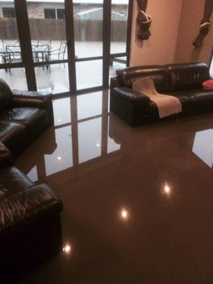 The flooded lounge in Nadia Bird's Mosgiel house. Photo supplied.