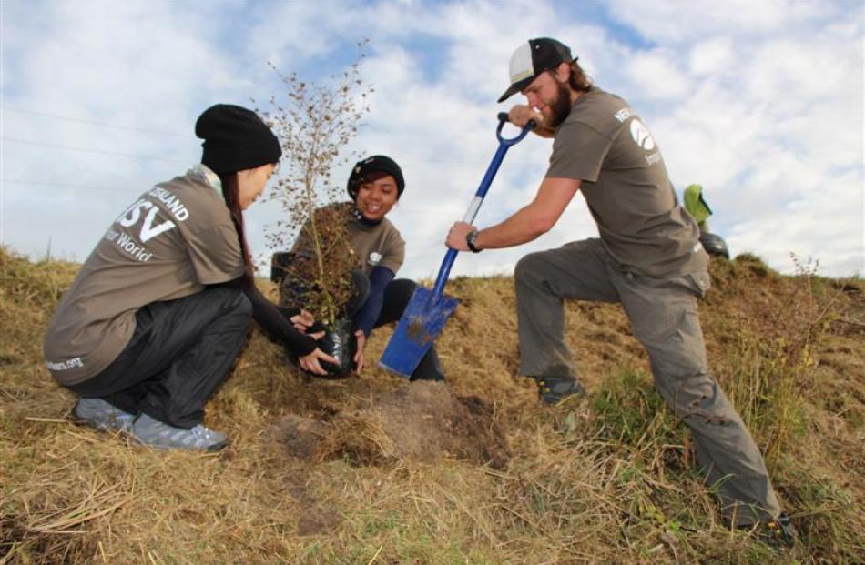 Voluntourists (from left) Jiaxin Zhang, of Xunan, China, Mary Lapuz, of Windsor, Canada, and...