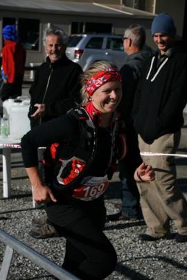 Hollie Woodhouse, of Christchurch, is all smiles as she finishes the Mt Difficulty Ascent solo...