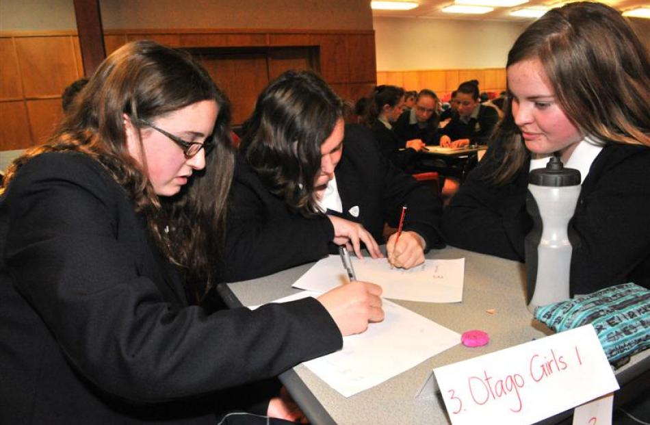 Concentrating hard  are (from left) Ella Steel (13), Abigail Thompson (13) and Judy Kingham (14)...