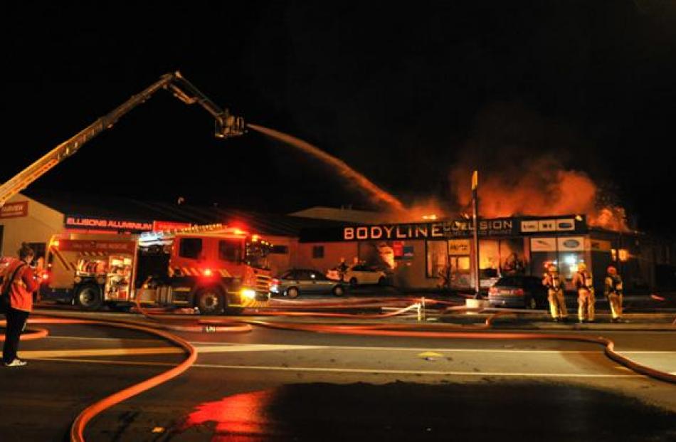 Firefighters converge at last night's blaze at Bodyline Collision Panel and Paint in Wharf St,...