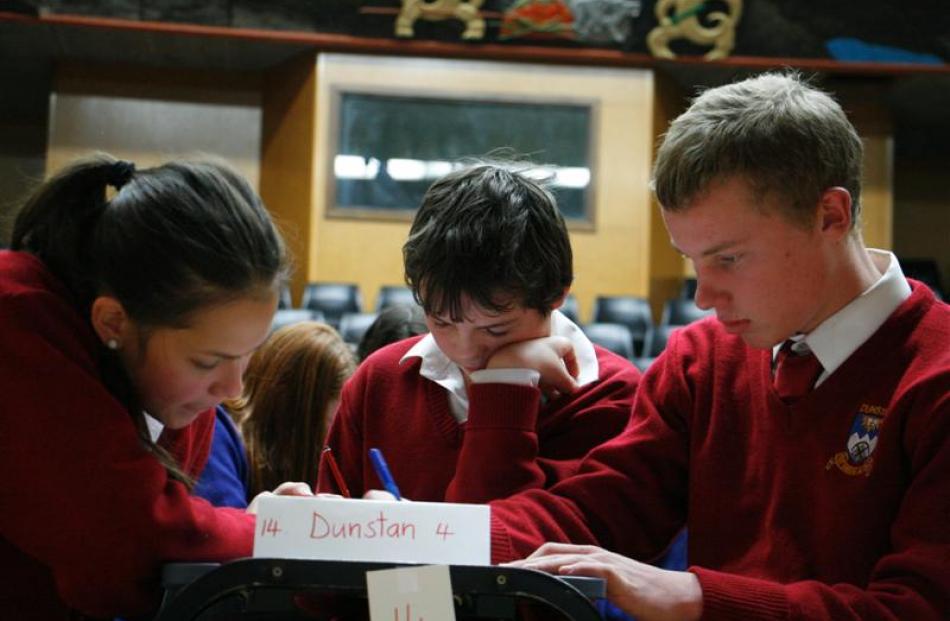 Dunstan High School pupils (from left) Natasha Legrand, Damien Miller, and Caleb Middendorf (all...