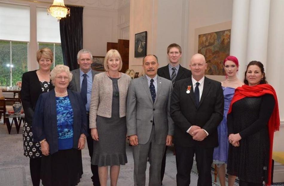 (Back, from left) Trish Oakes, Malcolm Oakes, Dion Oakes, Amy Oakes, (front, left) Molly Oakes,...