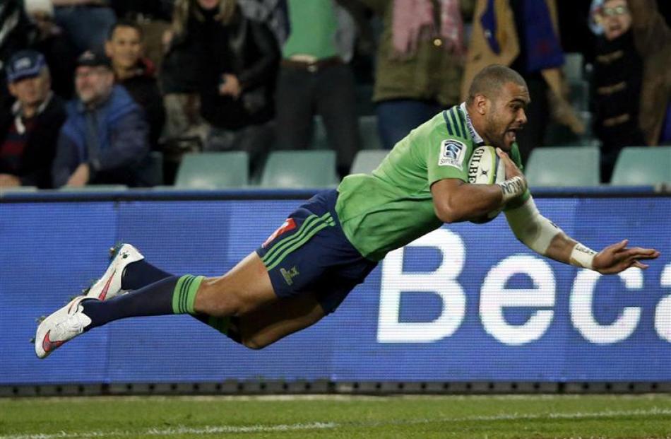 Highlanders winger Patrick Osborne flies through the air on his way to scoring the final try.