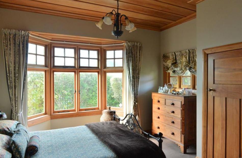 In the main bedroom, a wardrobe (at right) has been built into what was the fireplace.