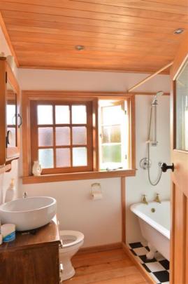 The compact bathroom had an external door,  later replaced by a window.