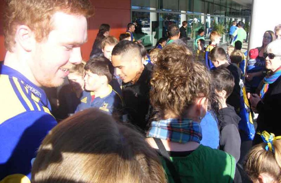 Aaron Smith is mobbed by fans.