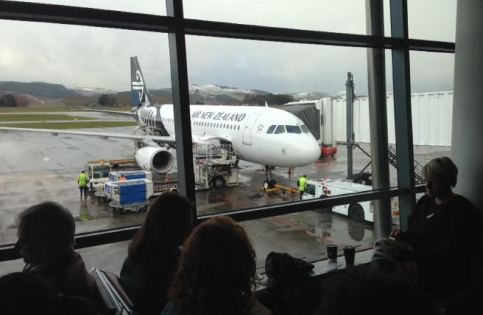 Passengers waiting for conditions to clear at Dunedin Airport. Photo by Sean Flaherty