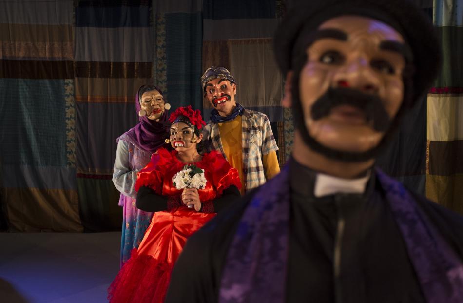 The cast regularly change costume and masks throughout the show.