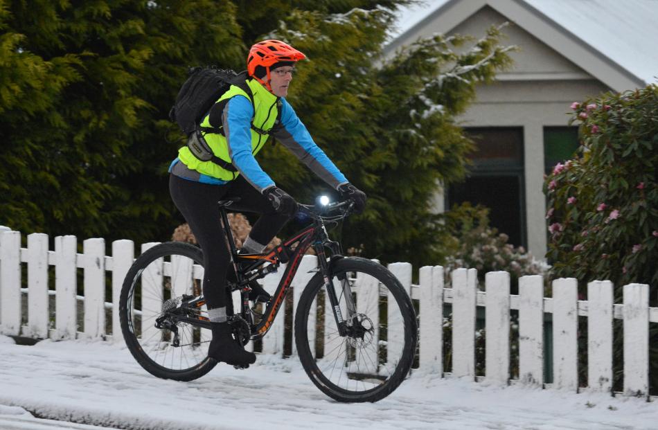 A cyclist takes to the footpath on Taieri Rd. Photo by Gregor Richardson