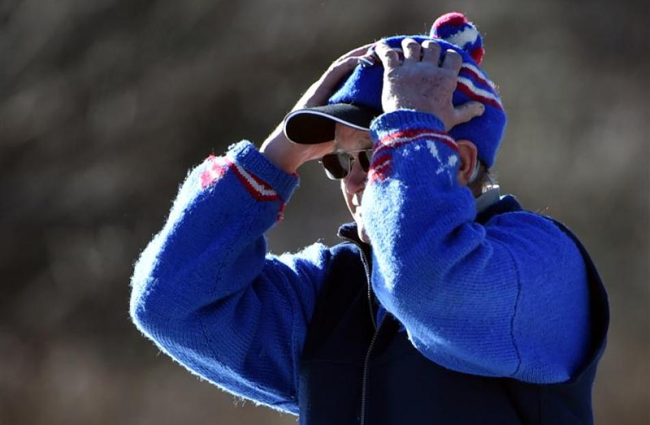 Stu Francis has a tense moment after delivering one of his  curling stones.