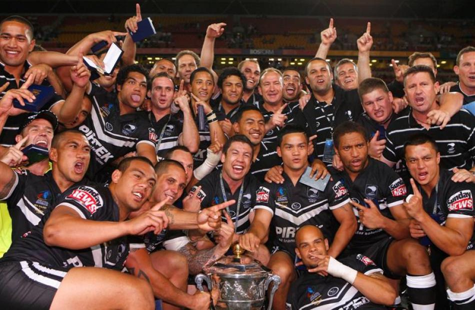 The Kiwis celebrate with the World Cup trophy. Photo from Getty Images.