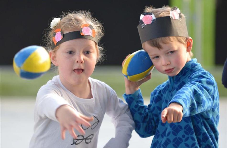 Wakari School pupils Dakota McLean (6) and Flynn Richards (5), take aim in a throwing challenge.