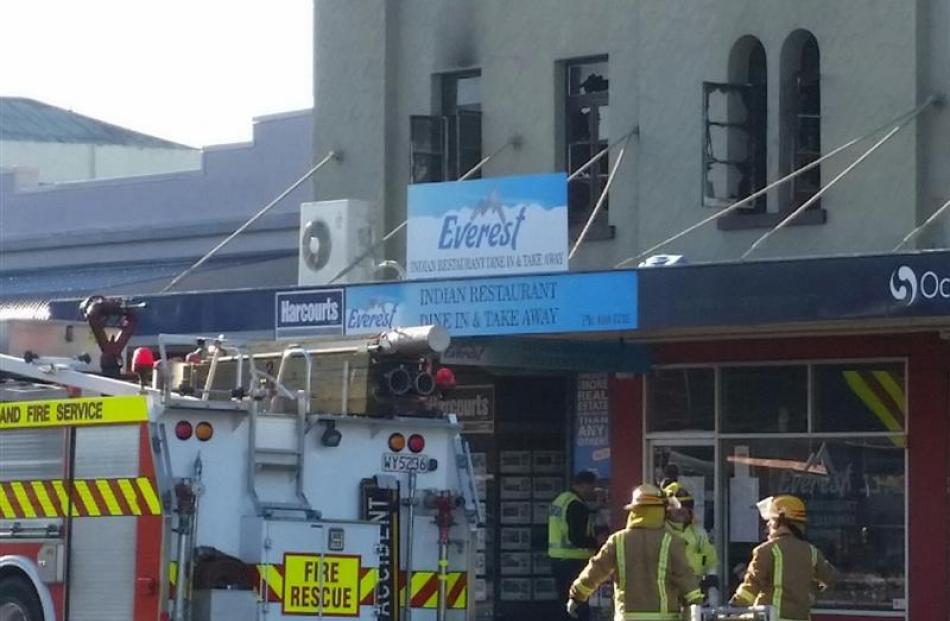 Firefighters at the scene on Queen St. Photo by David Bruce