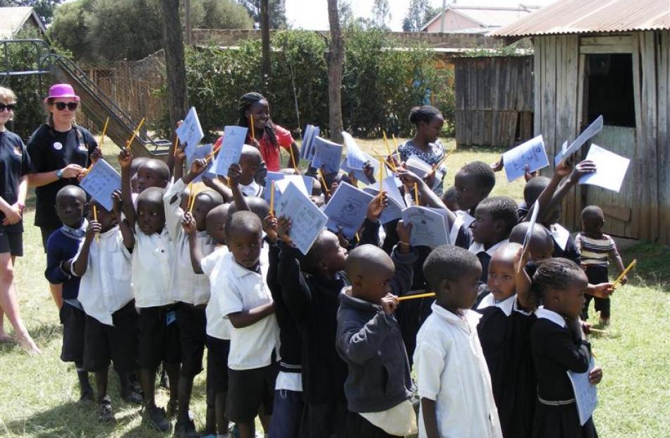 Njoro School pupils in Kenya with books and pencils provided by Taieri College pupils.