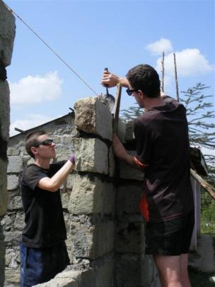 Taieri College pupils (from left) Sean McDonald and Adam Greer help build a classroom at Njoro...