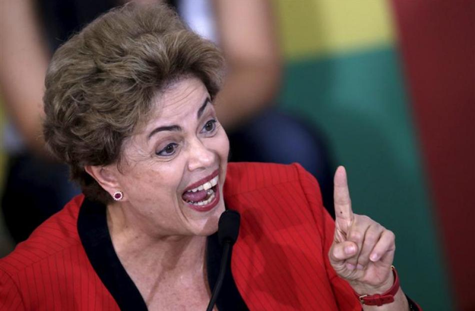 President Dilma Rousseff speaks during a conference with representatives from workers' unions and...