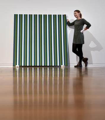 New Dunedin Public Art Gallery curator Lucy Hammonds installs a Julian Dashper work Untitled 1991...