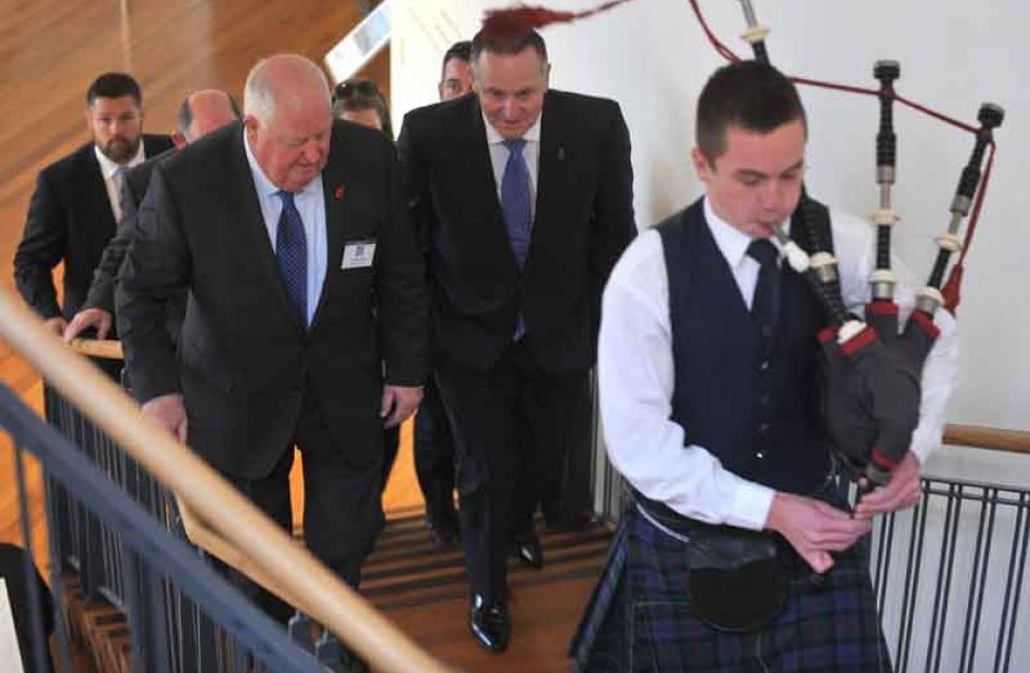 Allied Press managing director Sir Julian Smith and Prime Minister John Key are piped in to the...