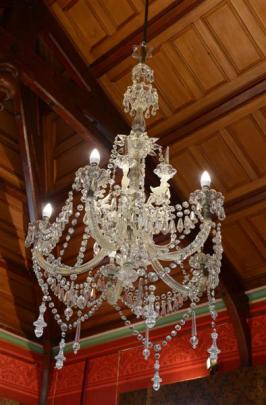 The room is 5m high and a long tool was needed to clamp and turn the gas taps on the chandelier.