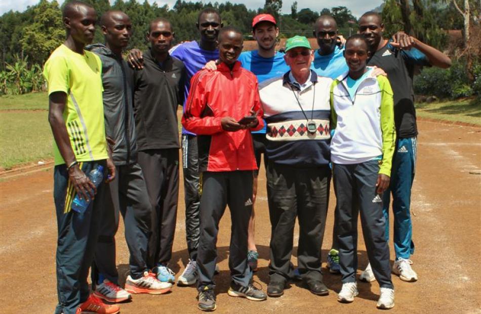 Peter Meffan,  David Rudisha (fourth from left) and coach Colm O'Connell pose with the training...